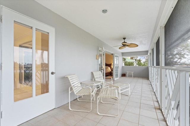 sunroom / solarium with ceiling fan