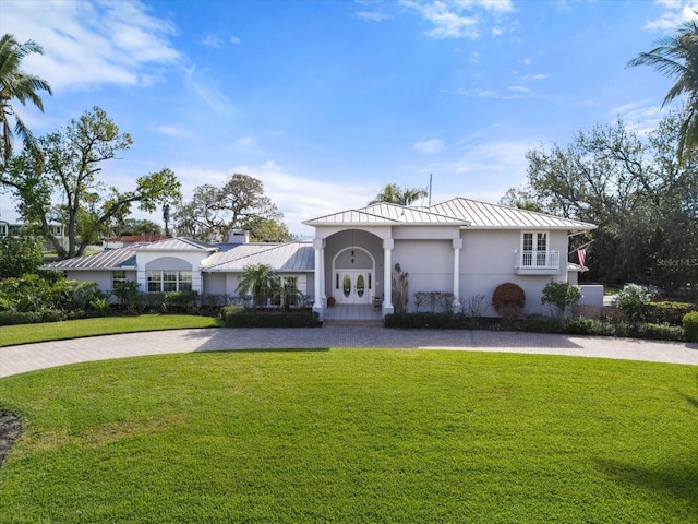 ranch-style house with a front lawn