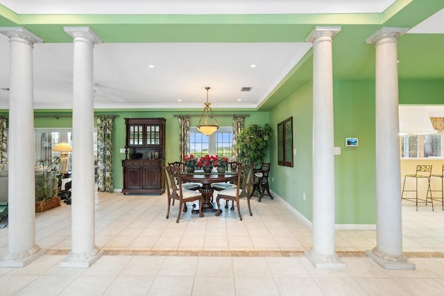7056 Hawks Harbor Cir, Bradenton, FL 34207 - dining room featuring crown molding, decorative columns, and light tile patterned floors