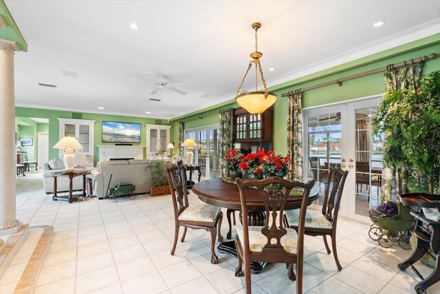 7056 Hawks Harbor Cir, Bradenton, FL 34207 - dining space featuring light tile patterned floors, french doors, crown molding, and decorative columns
