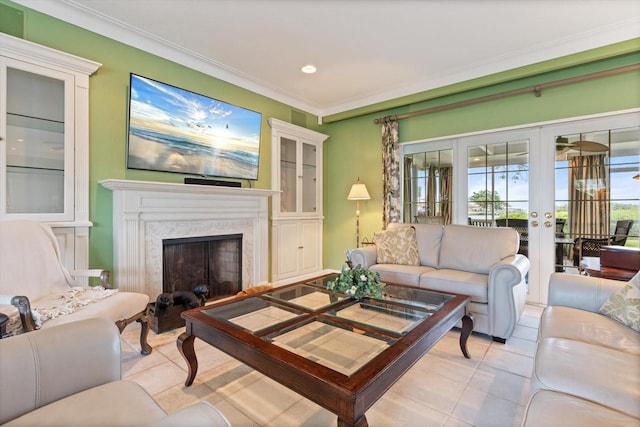 7056 Hawks Harbor Cir, Bradenton, FL 34207 - living area with french doors, ornamental molding, and a fireplace