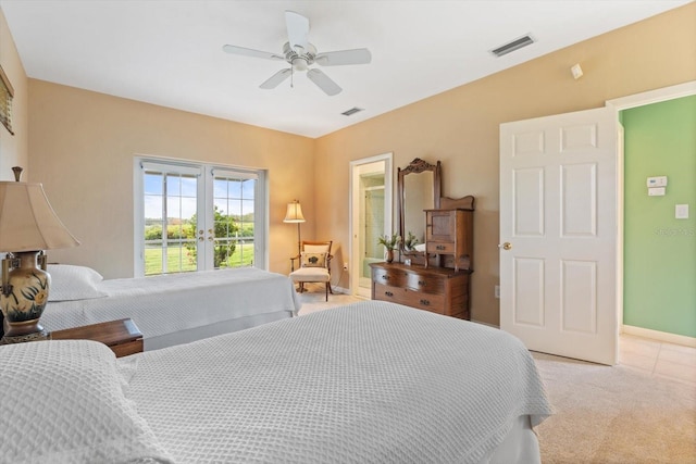 7056 Hawks Harbor Cir, Bradenton, FL 34207 - bedroom with french doors, light colored carpet, visible vents, and a ceiling fan