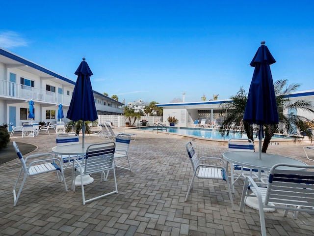 view of swimming pool featuring a patio