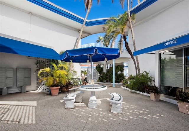 view of patio / terrace with a mail area