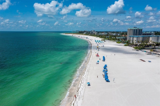 aerial view featuring a view of the beach and a water view