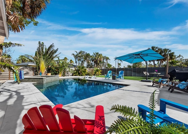 view of swimming pool with a patio