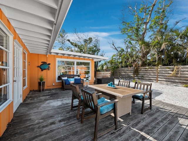 wooden deck featuring an outdoor hangout area and french doors