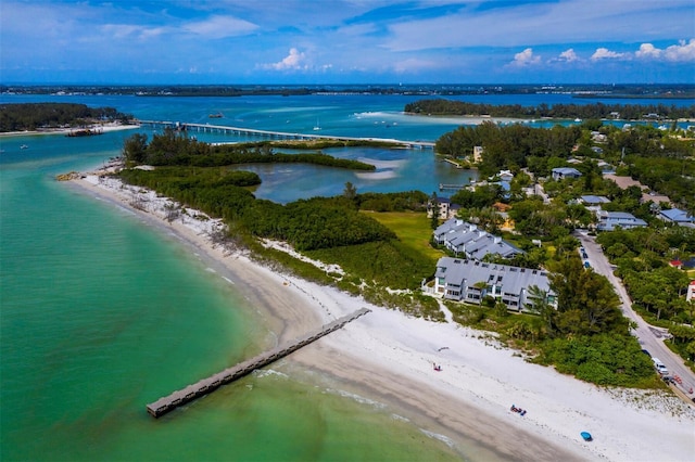 aerial view featuring a water view and a beach view