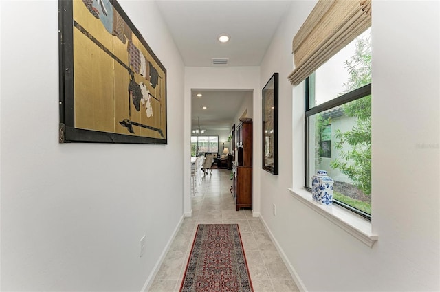 hallway with light tile patterned floors