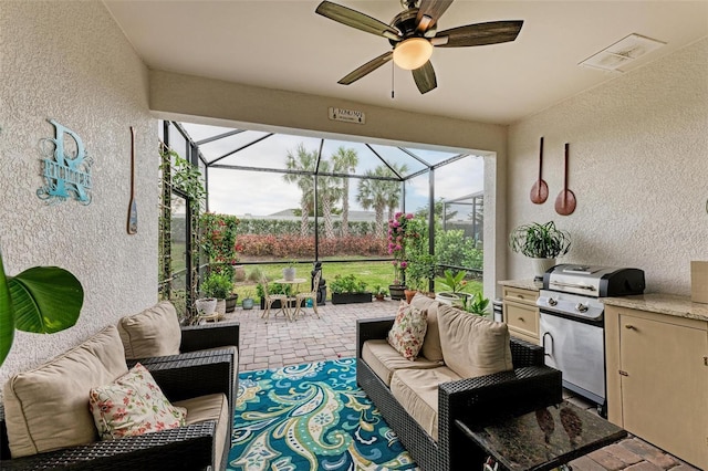 sunroom / solarium with ceiling fan