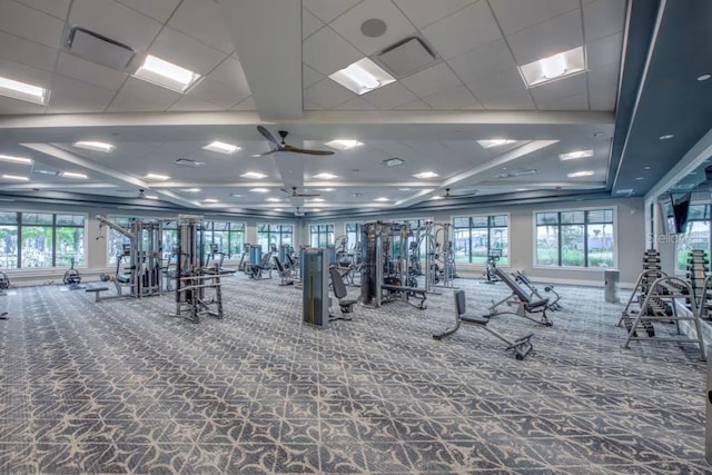 gym with ceiling fan and carpet