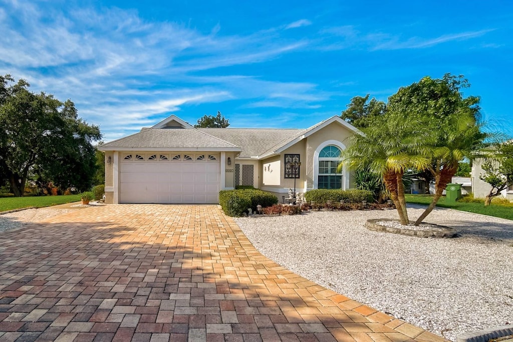 ranch-style home featuring a garage