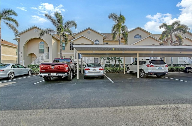 view of vehicle parking with a carport