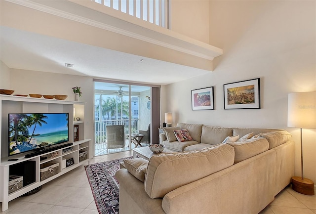 tiled living room featuring ceiling fan