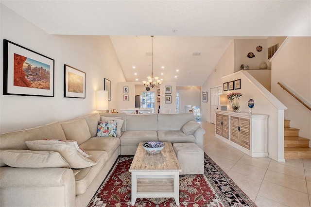 tiled living room featuring a chandelier and high vaulted ceiling