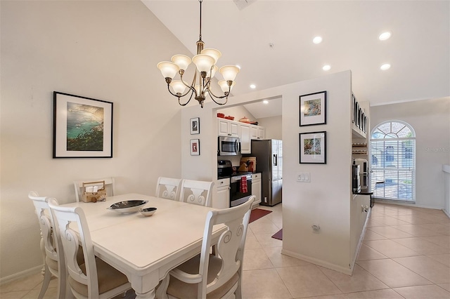 tiled dining space with a notable chandelier and lofted ceiling