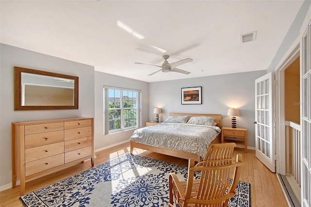 bedroom with ceiling fan and light hardwood / wood-style flooring