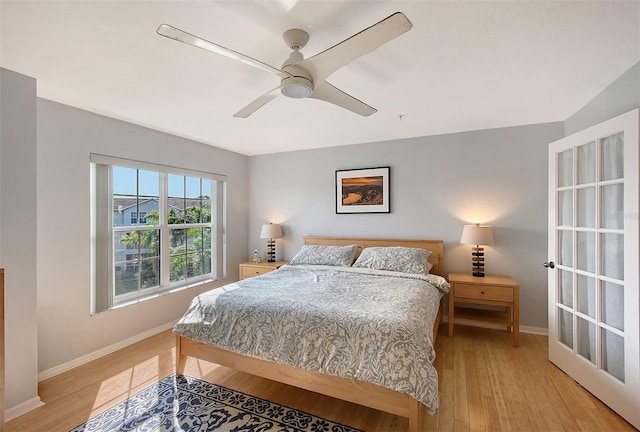 bedroom featuring ceiling fan and light hardwood / wood-style flooring