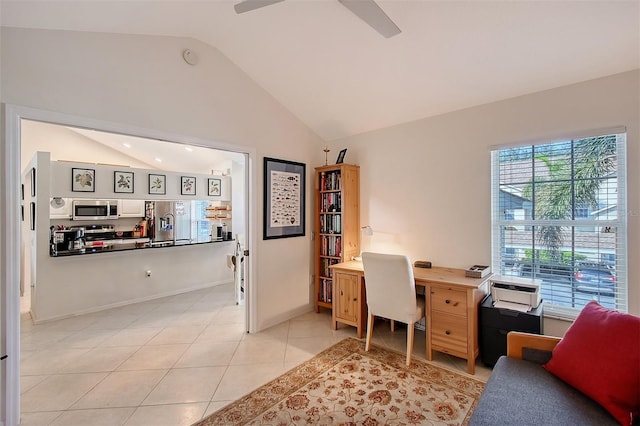 tiled office space with ceiling fan, a healthy amount of sunlight, and lofted ceiling