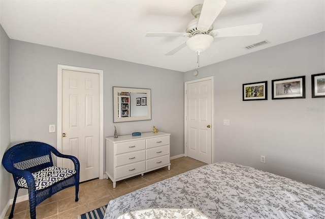 bedroom featuring ceiling fan and light tile patterned flooring