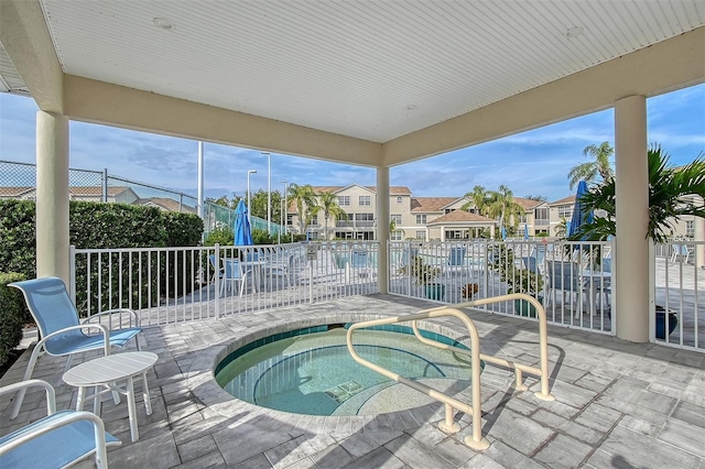 view of pool featuring a patio area and a hot tub