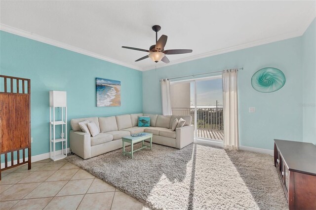 tiled living room featuring ceiling fan and ornamental molding