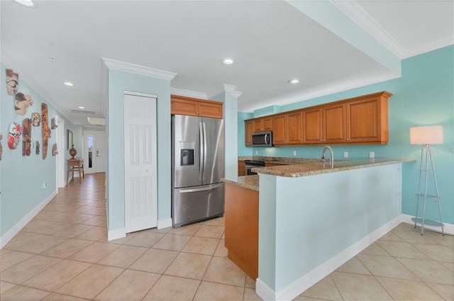 kitchen with kitchen peninsula, light tile patterned flooring, stainless steel appliances, ornamental molding, and light stone counters