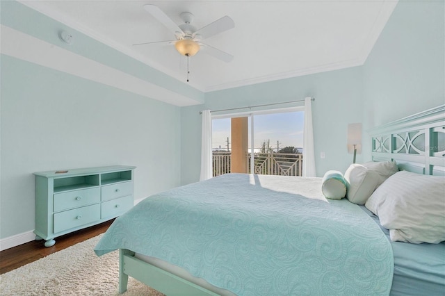 bedroom with ceiling fan, access to exterior, dark wood-type flooring, and ornamental molding