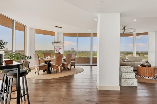 3060 Grand Bay Blvd Unit 175, Longboat Key, FL 34228 - dining space featuring expansive windows, hardwood / wood-style flooring, plenty of natural light, and recessed lighting