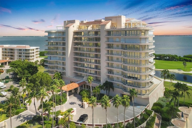 3060 Grand Bay Blvd Unit 175, Longboat Key, FL 34228 - property at dusk featuring a view of apartment building / complex and a water view