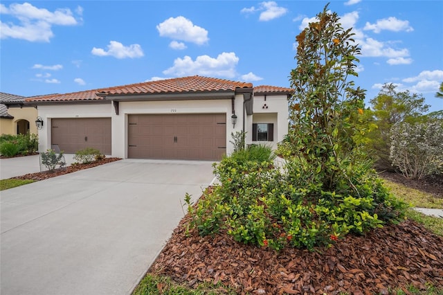 mediterranean / spanish-style home featuring a garage