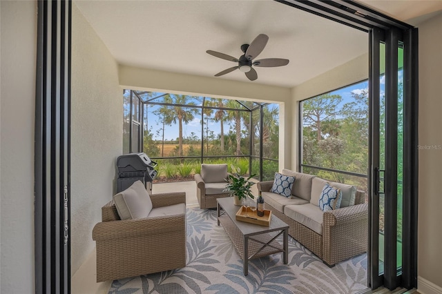 sunroom / solarium with ceiling fan and a healthy amount of sunlight