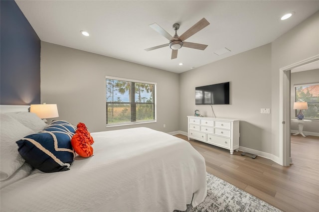 bedroom featuring ceiling fan and wood-type flooring