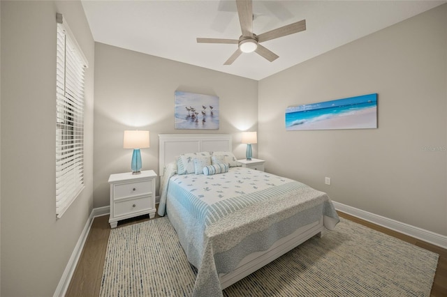 bedroom with ceiling fan and hardwood / wood-style flooring