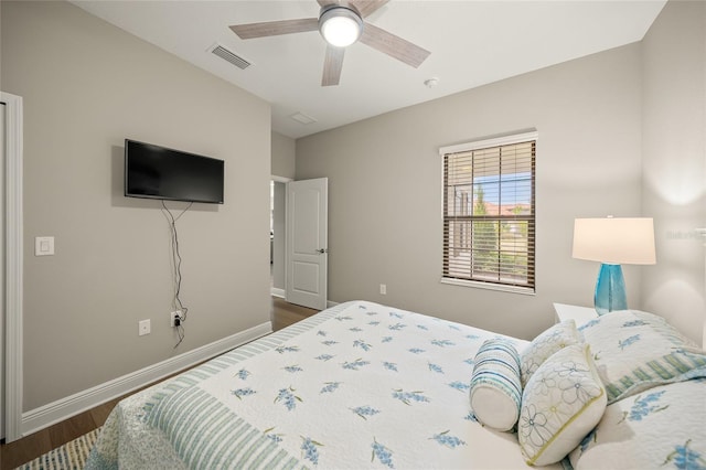 bedroom featuring ceiling fan and dark wood-type flooring