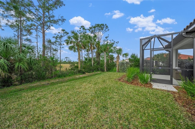 view of yard with a lanai