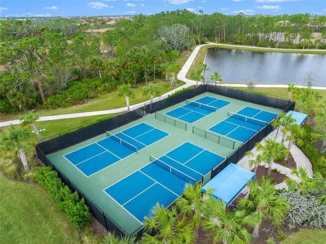 birds eye view of property with a water view