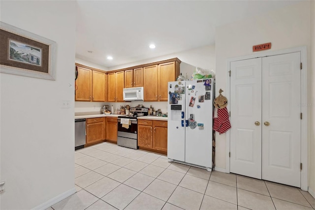 kitchen with appliances with stainless steel finishes and light tile patterned flooring