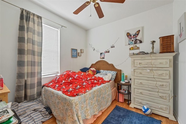 bedroom featuring ceiling fan and light hardwood / wood-style floors