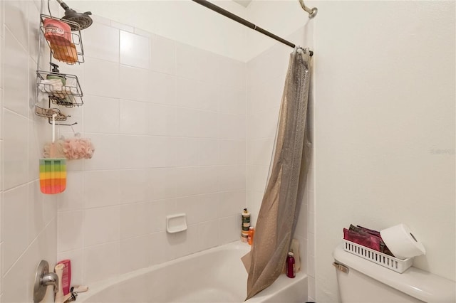 bathroom featuring toilet and shower / bathtub combination with curtain