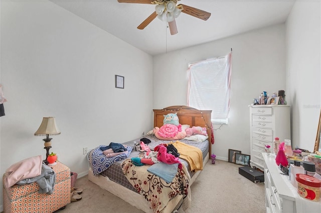 bedroom with ceiling fan and light colored carpet