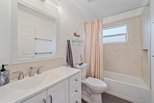 full bathroom with shower / bath combo with shower curtain, toilet, and vanity