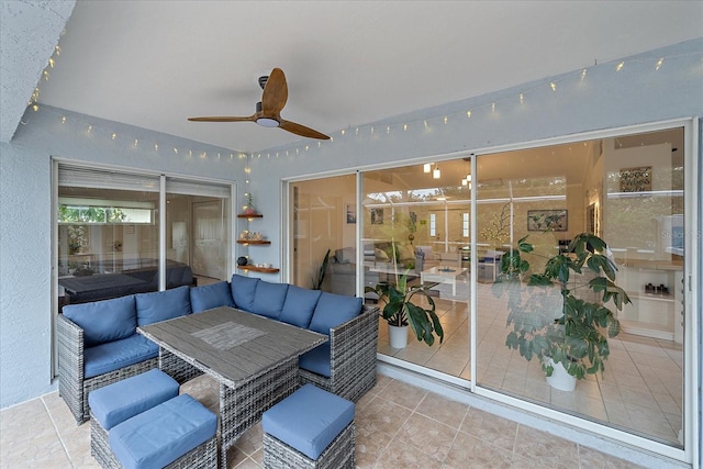 view of patio / terrace featuring ceiling fan and an outdoor living space