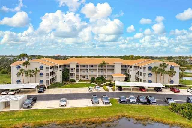 birds eye view of property with a water view