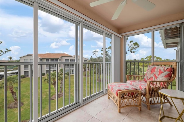 sunroom / solarium featuring ceiling fan and a wealth of natural light