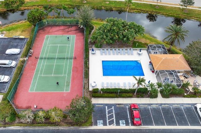 birds eye view of property with a water view