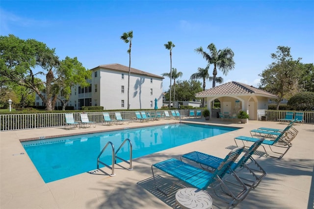 view of swimming pool with a patio area