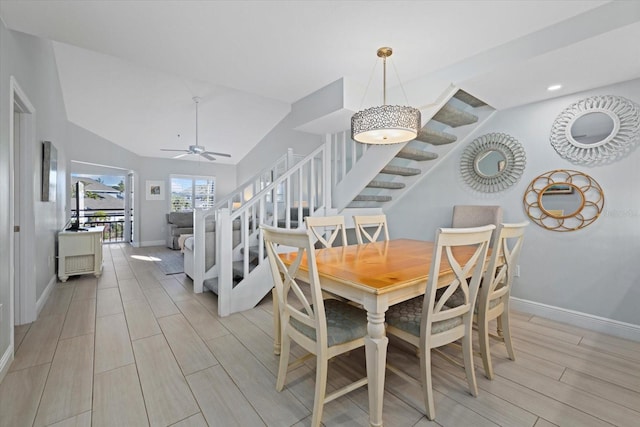 dining room with ceiling fan and vaulted ceiling