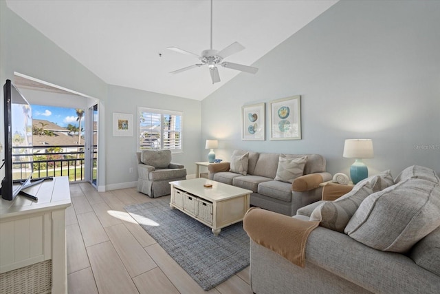 living room featuring vaulted ceiling and ceiling fan