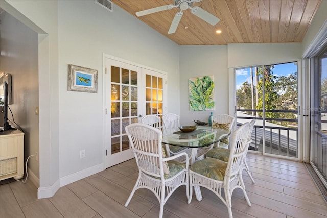 dining space with wooden ceiling, lofted ceiling, and french doors